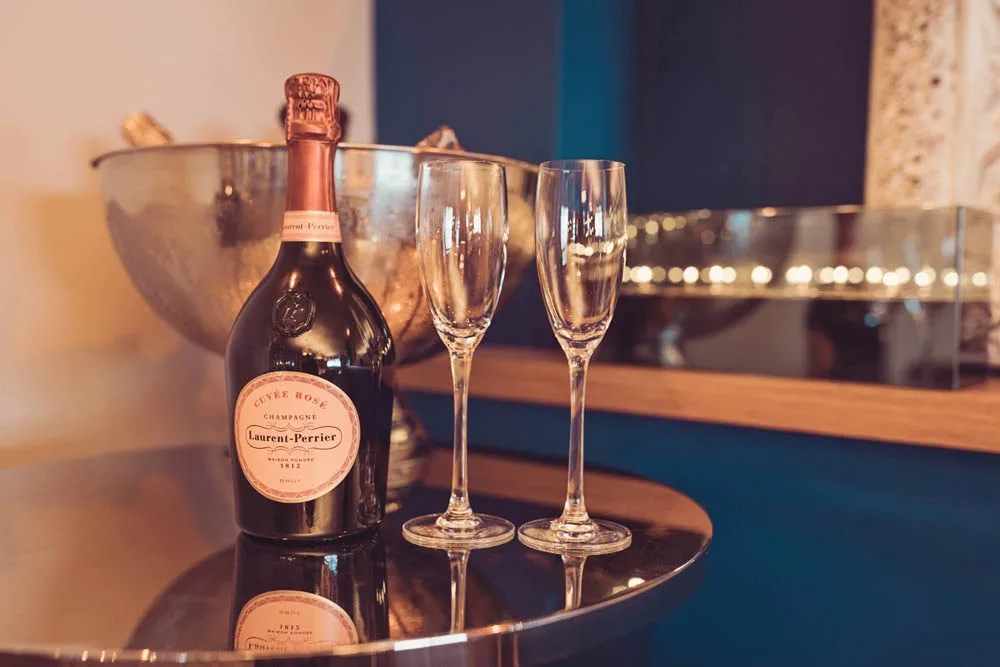 Champagne and two flutes ready on the bar