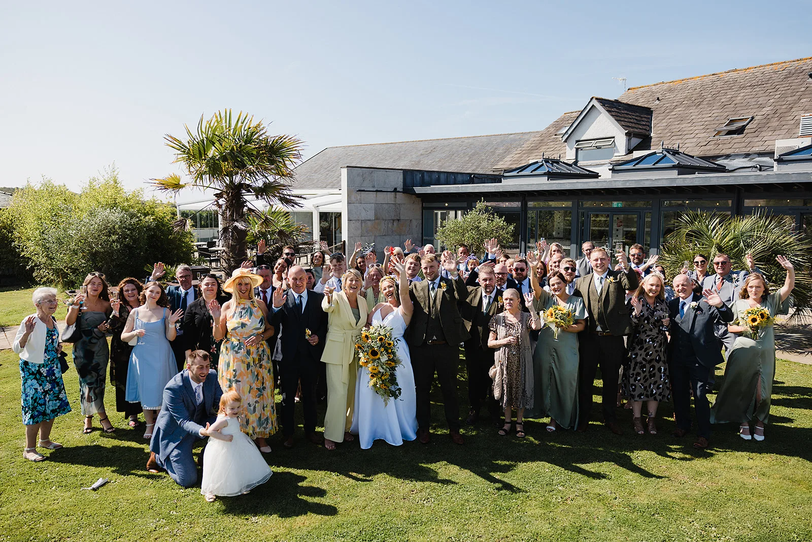 The whole wedding party gathered on the lawn
